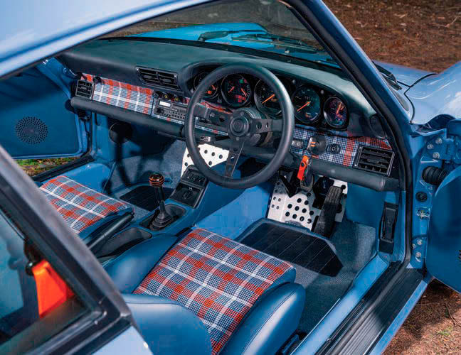 SEATS ARE FROM A 911 TURBO, CUSTOM-TRIMMED IN SPIRIT OF LE MANS TARTAN, WHICH SEEMS ENTIRELY APPROPRIATE
